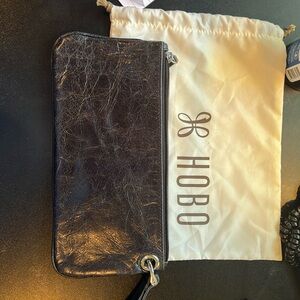 HOBO black women’s clutch with dust cover